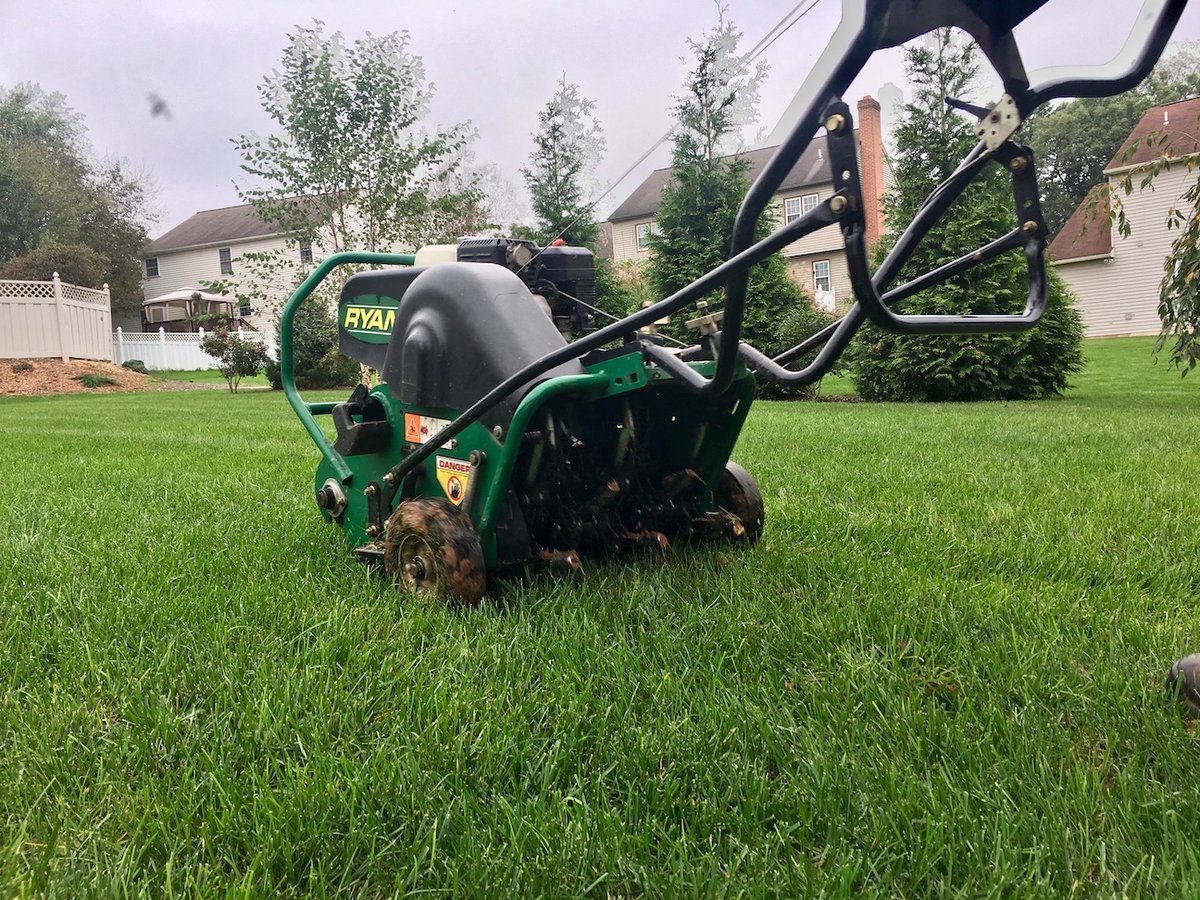 walk behind lawn aerator aerates grass