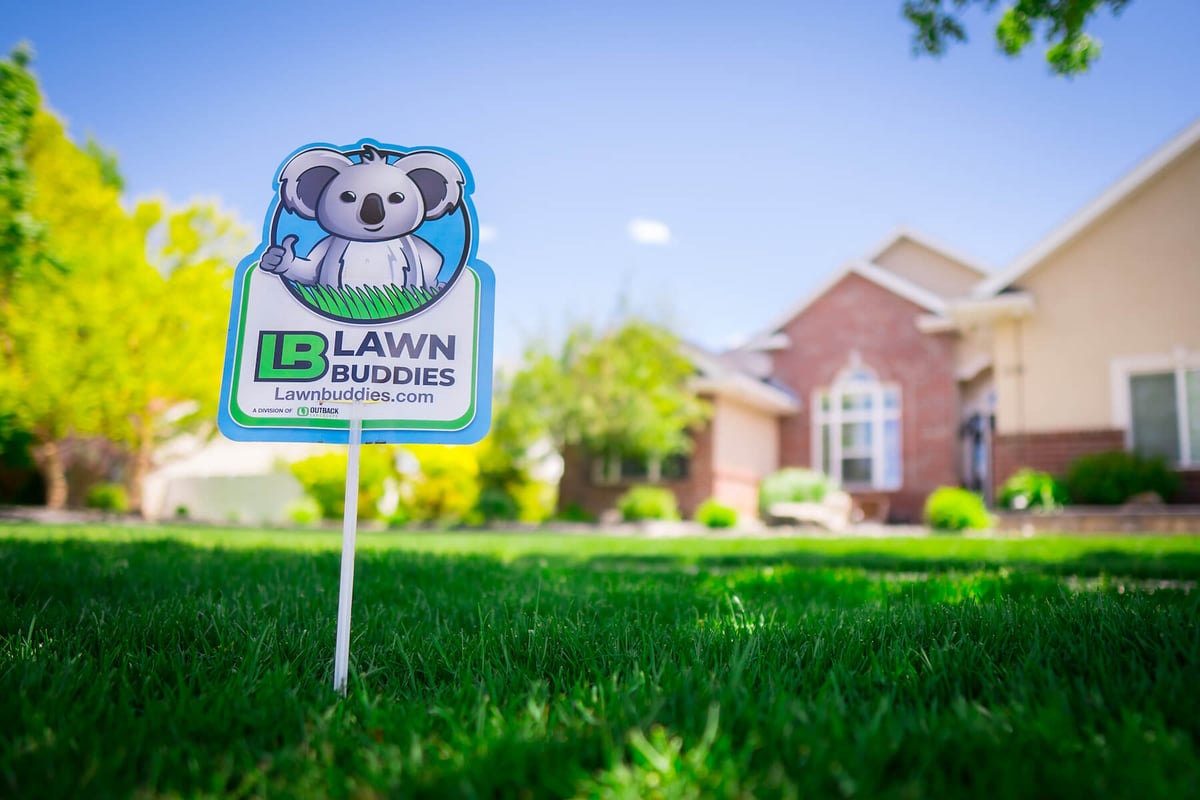 lawn with lawn buddies fertilization sign