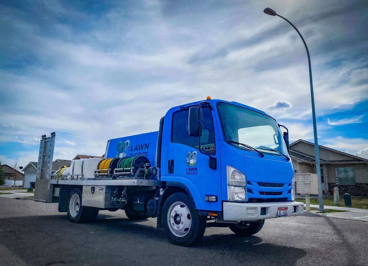 Lawn Buddies Truck with hoses for pest control spray