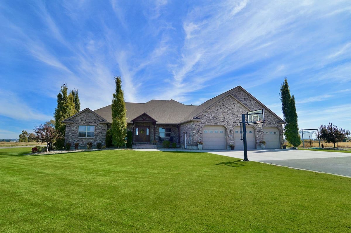 healthy green grass in front of home