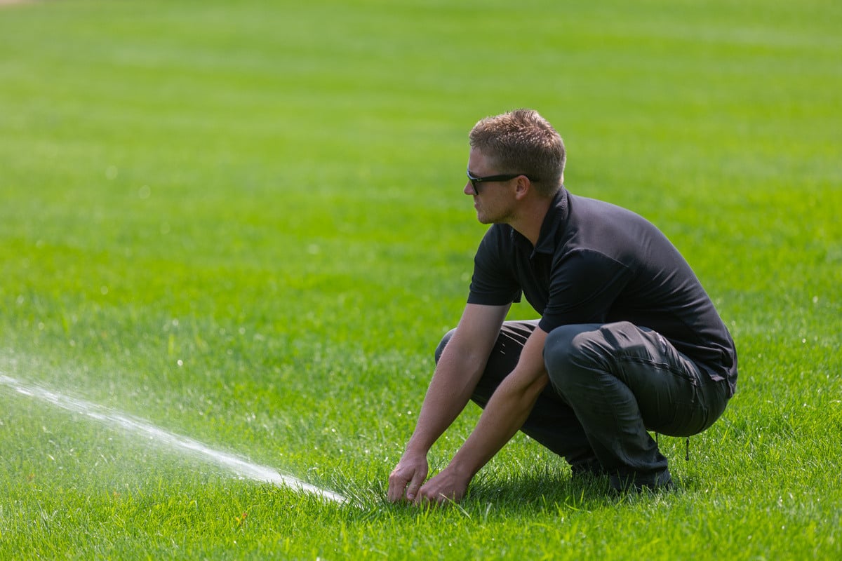 crew technician irrigation lawn green grass turf service sprinkler water adjust 2