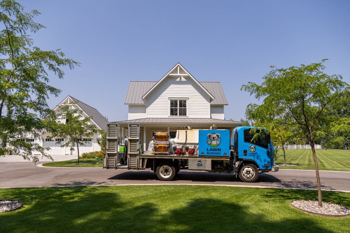 lawn nice green turf shade trees home house front entry entrance lawn truck crew