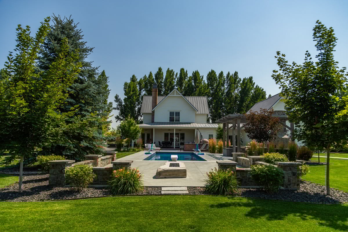 plants turf gravel pool pergola house trees evergreens patio grass
