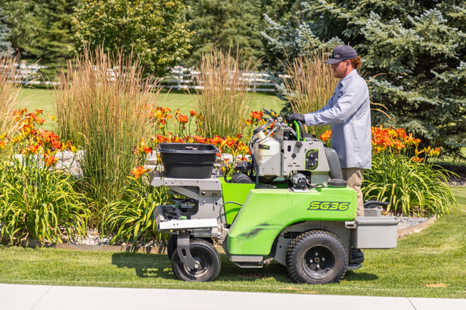 yard service action machine home house green turf lawn trees plants grasses