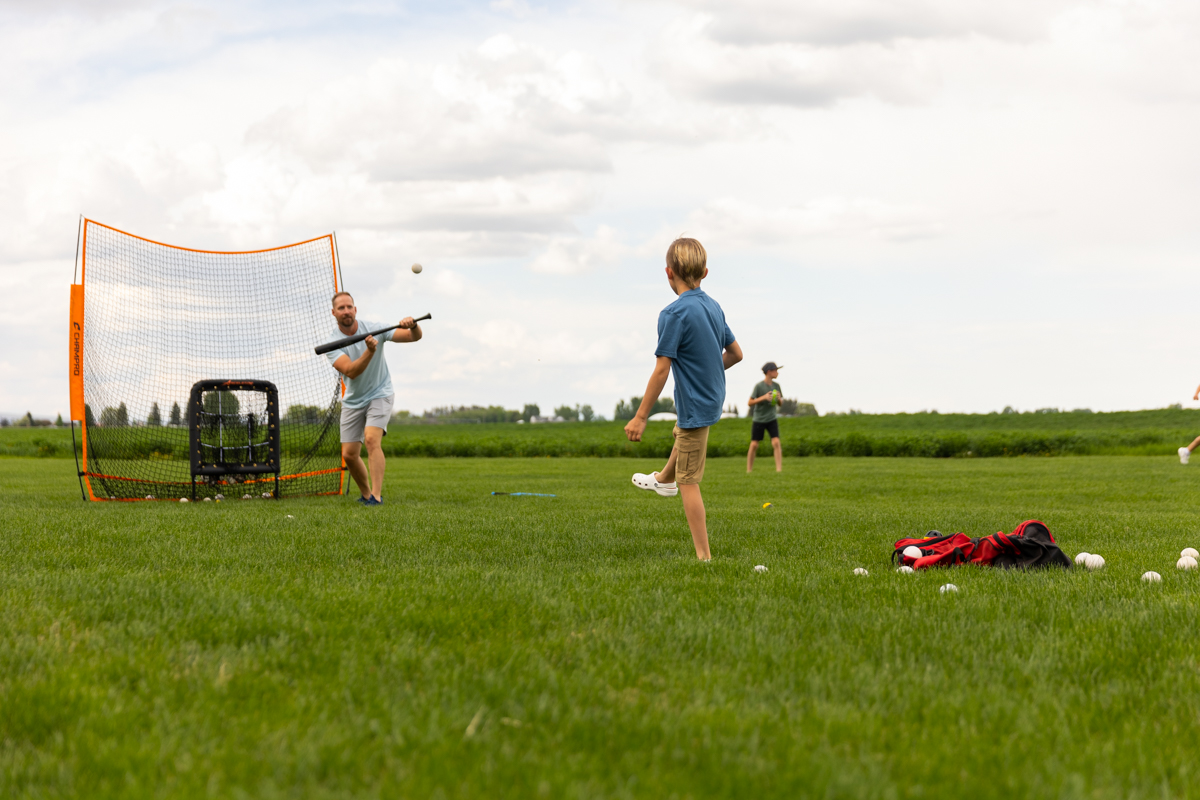 Healthy lawn in Idaho Falls with family playing